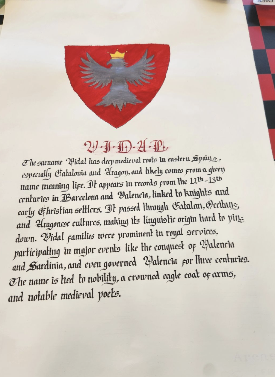 Hand-painted family coat of arms with a calligraphic surname history