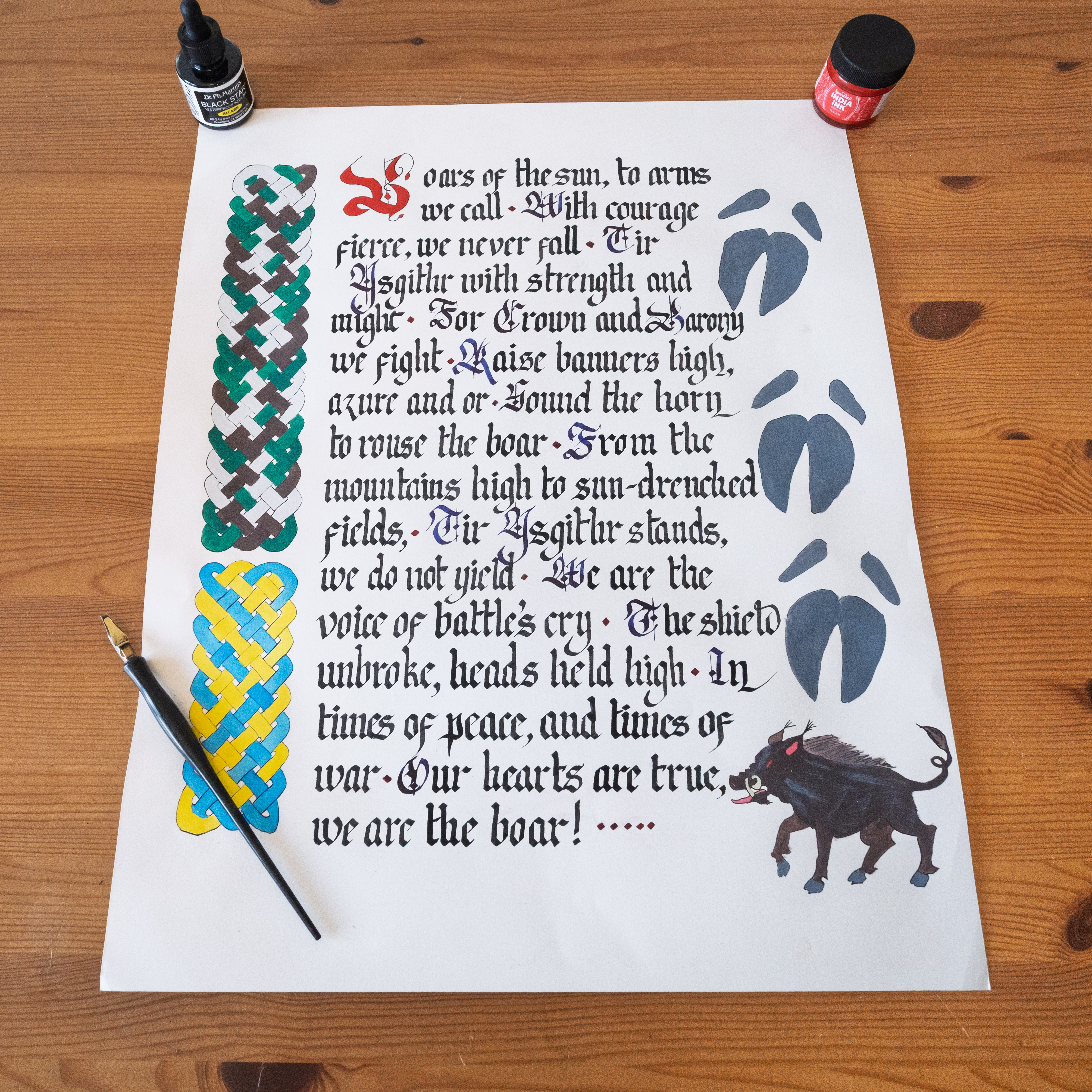 Sixteen by twenty blackletter calligraphy commission with red initial, candle, autumn leaves, and bull illustration